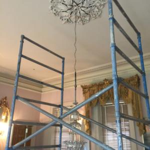 Bluelab raising Como House chandelier after restoration